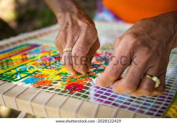 Beautiful image of lacemakers in the state of\
Alagoas making pieces of the famous filet lace. lace crafts that\
became known around the\
world