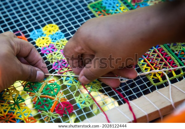 Beautiful image of lacemakers in the state of\
Alagoas making pieces of the famous filet lace. lace crafts that\
became known around the\
world
