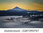 Beautiful image of Mount Hood over foggy forest at Jonsrud Viewpoint during sunrise