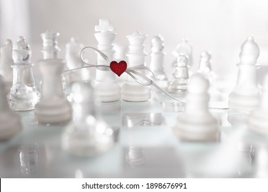 Beautiful image with table game game - chess reflecting a couple in love bound together in marriage. Greeting or invitation card in Valentine's day.