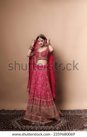 Beautiful Indian bridal in studio shot. 
Magnificent young Indian bride in luxurious bridal 