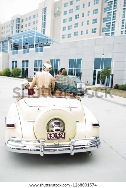 Beautiful Indian\
Bride and Groom going in car after their wedding ceremony. Karachi,\
Pakistan - December 27,\
2018.