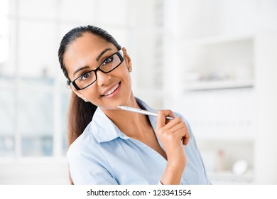 Beautiful Indian business woman portrait smiling happy