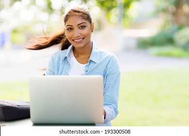 Beautiful Indian College Student With Laptop Sitting Outdoors