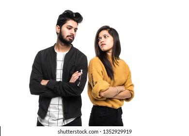 Beautiful Indian Couple Standing Apart From Each Other While Being In A Quarrel On White Background.