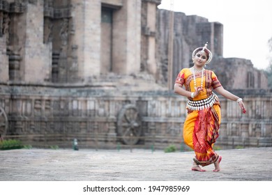 Beautiful indian dancer in the posture of Indian dance.Indian classical dance odissi.