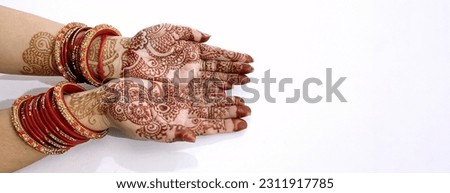 A Beautiful Indian female hands with henna tattoo isolated on white background