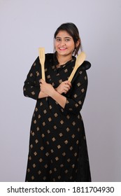 Beautiful Indian Girl Or Woman Or Home Maker Holding Serving Spoon Or Kitchen Ware In Hand.