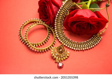 Beautiful Indian gold jewelry set with necklace and bangles. Close up jewelery and ornaments for Indian women or bride. 