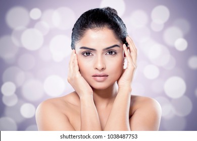 Beautiful Indian Woman With Healthy Skin Against Blurred Lights Background. Asian Beauty And Skincare Concept