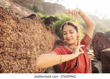 Beautiful Indian Woman In Red Saree Dancing Traditional Bharatanatyam Dance