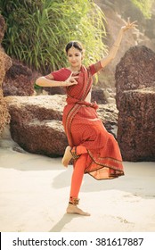 Beautiful Indian Woman In Red Saree Dancing Traditional Bharatanatyam Dance