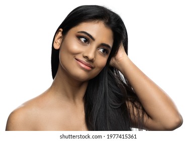 Beautiful Indian woman with smooth skin and long black hair on white background