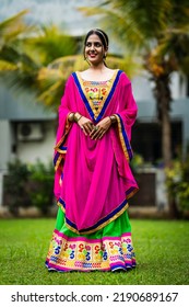 Beautiful Indian woman in traditional chaniya choli for navratri. Navratri is an Indian Festival and Chaniya choli its traditional costume - Shutterstock ID 2190689167