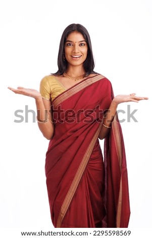 Beautiful Indian young woman in traditional saree and greeting isolated on white.