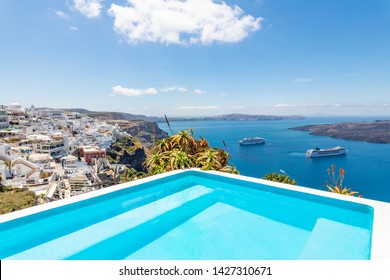 Beautiful infinity pool with famous destination view in Santorini, Greece. Summer vacation and holiday concept, luxury travel. Wonderful scenery, cruise ships and white architecture. Amazing landscape