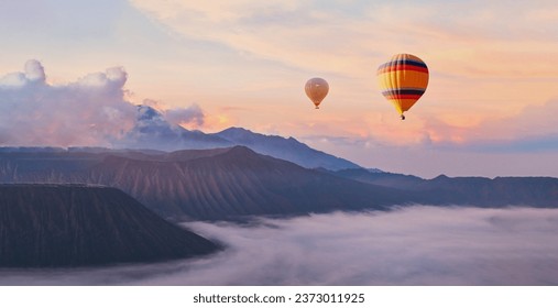 beautiful inspirational sunrise landscape with hot air balloons in sky, nature travel destination, scenic view banner background - Powered by Shutterstock