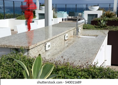 Beautiful installation of granite countertops in an outdoor setting on the ocean.