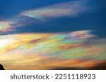 Beautiful iridescent cloud, Irisation. Skyscraper background.