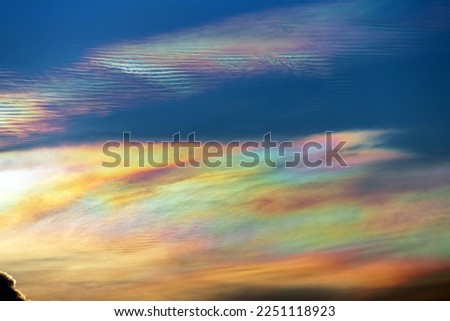 Beautiful iridescent cloud, Irisation. Skyscraper background.