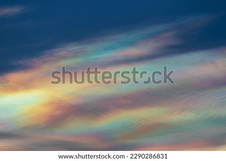 Beautiful iridescent cloud, Irisation. Skyscraper background.
