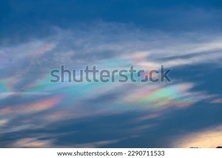 Beautiful iridescent cloud, Irisation. Skyscraper background.