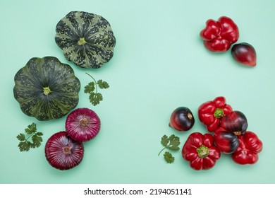 Beautiful Irregular Shaped Vegetables On A Green Background. Food Waste From Supermarket. Trendy Vegetables Concept. Healthy Food. Raw Vegetables Varied Of Different Shapes. Selective Focus. Top View