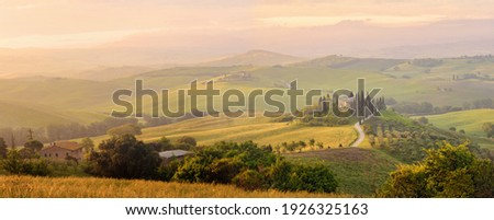 Beautiful Italian Landscape Early In The Morning In Sunbeams. Tuscany Italy