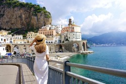 Beautiful Italy. Back View Of Tourist Girl Visiting Amazing Amalfi Coast, Italy. Wide Angle.