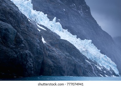 A beautiful jagged glacier flows down the mountain in Drygalski Fjord, South Georgia.  - Shutterstock ID 777074941
