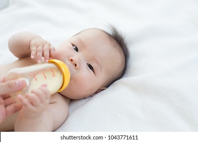 beautiful japanese baby drinking