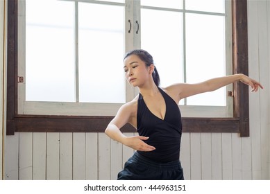 Beautiful Japanese Female Ballet Dancer is Practicing