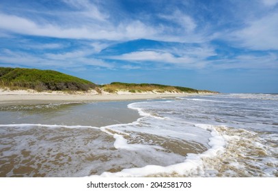 Beautiful Jekyll Island beach. Landscape of dunes, beach and ocean  One of the  Golden Isles barrier islands off of Georgia, USA.