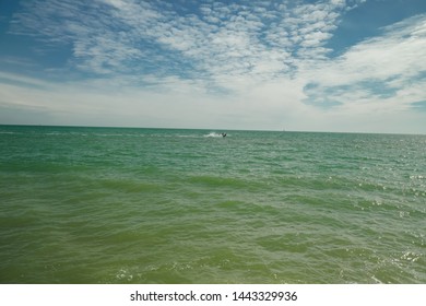 Beautiful Jet Ski Stunt With Lovely Skyline In The Background.