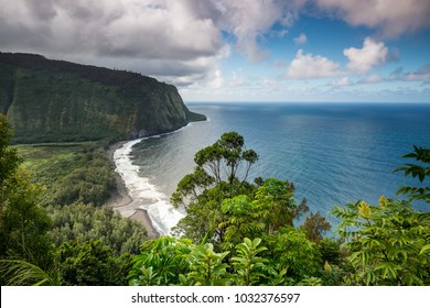 Beautiful jungle view of Waipio Valley and the black sand beach on the Big Island of Hawaii