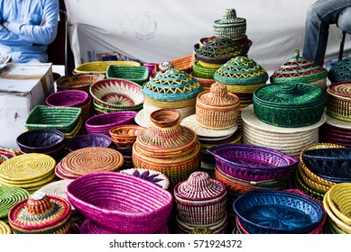 Beautiful jute baskets of different colours for sale at a shop in India.