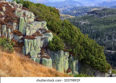 Beautiful Karkonosze mountains in Poland. Steep rocks with deep woods on background