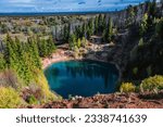 beautiful karst lake, picturesque landscape, formed as result of karst failure, filled with azure water, green forest on edges, named sea eye, located in Mari El Republic, Russia