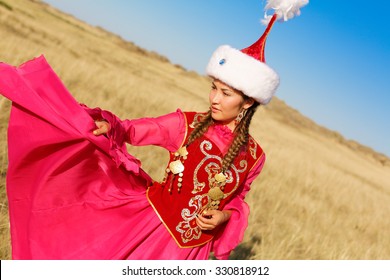 Beautiful Kazakh Woman In National Costume In The Steppe