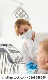 Beautiful Kid Boy In Dentist's Chair The Office Treats Teeth.