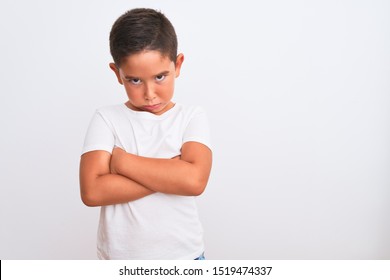 Beautiful Kid Boy Wearing Casual T-shirt Standing Over Isolated White Background Skeptic And Nervous, Disapproving Expression On Face With Crossed Arms. Negative Person.