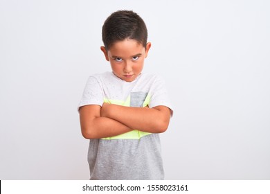 Beautiful Kid Boy Wearing Casual T-shirt Standing Over Isolated White Background Skeptic And Nervous, Disapproving Expression On Face With Crossed Arms. Negative Person.