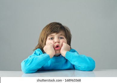 Beautiful Kid Feeling Bored Isolated On Grey Background