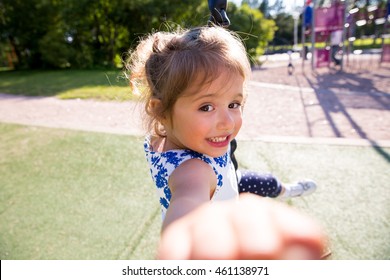 Beautiful Kid Taking Selfie In Green Summer Park, Laughing, Having Fun. Warm Sunny Weather, Healthy Child, Happiness, Freedom, Emotions. Cute Girl Reaching Hand To Camera. 