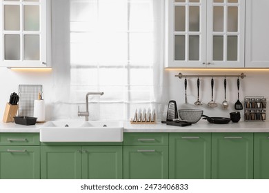 Beautiful kitchen interior with cooking utensils and stylish furniture - Powered by Shutterstock