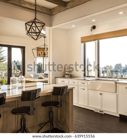 Elegant Beautiful Kitchen Island beautiful kitchen interior detail in new luxury home at sunrise features farmhouse sink kitchen island elegant pendant light fixtures and hardwood floor