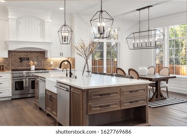 Beautiful Kitchen In New Traditional Style Luxury Home, With Quartz Counters, Hardwood Floors, And Stainless Steel Appliances