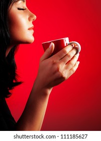 Beautiful Lady Drinking Coffee, Brunette Enjoy Cup Of Hot Chocolate, Side View Cute Girl Isolated On Red Background, Portrait Of Female With Morning Tea, Gorgeous Woman Holding Cappuccino Mug