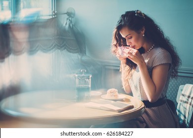 Beautiful Lady Reading Novel In A Cafe