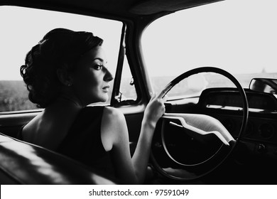 Beautiful Lady Sitting In A Retro Car